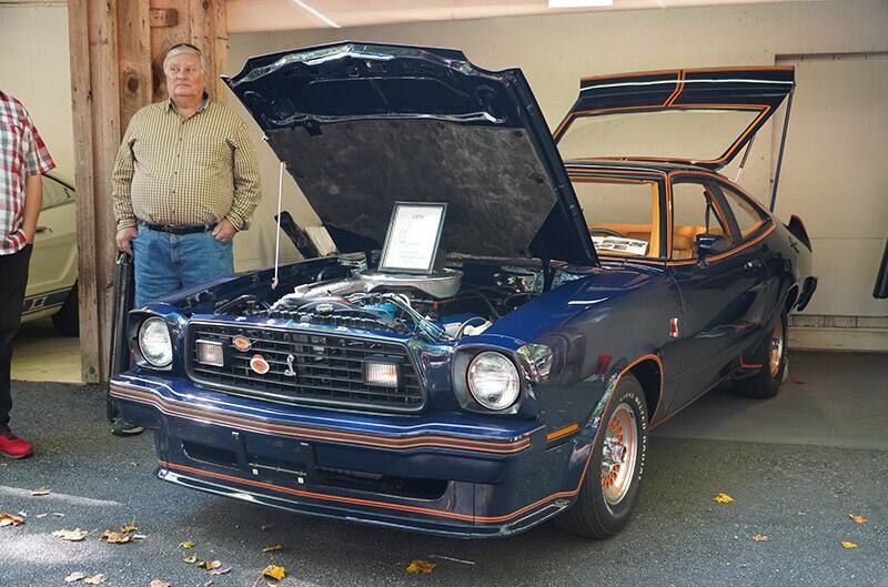 Blue Mustang II in garage spot