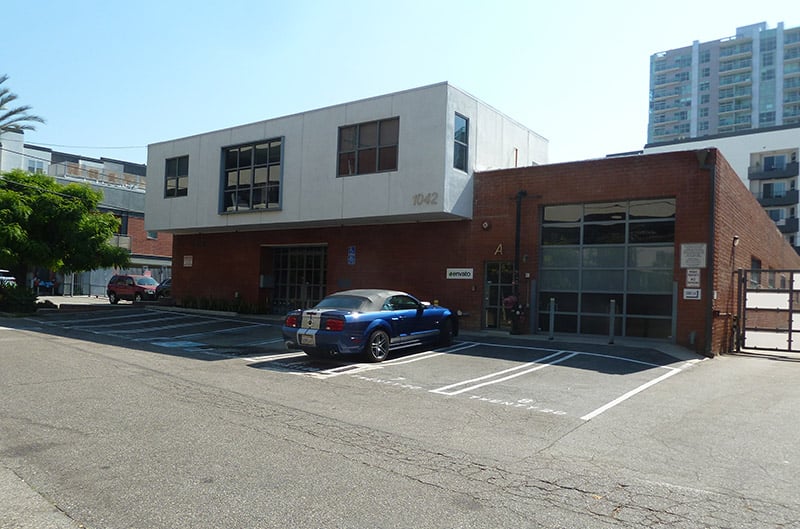 Princeton street building with blue shelby mustang parked in front