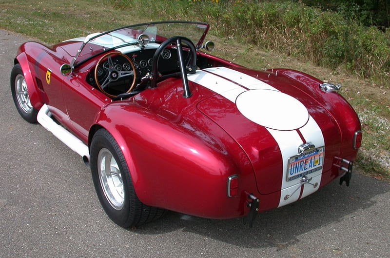 Rear of a Red Cobra on side of the road