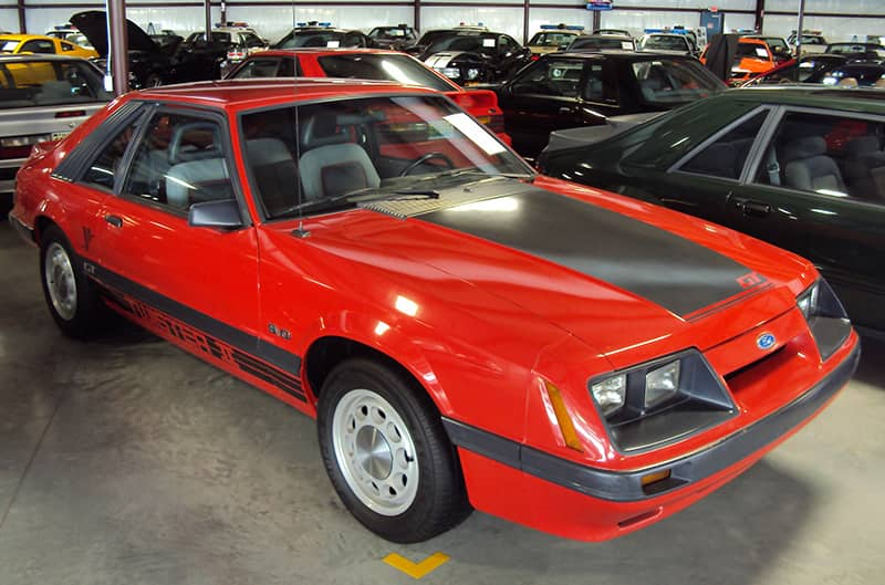 Red and black four-eyed foxbody mustang