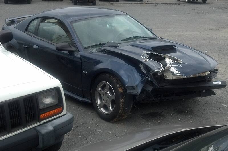 megans 2003 mustang after hitting a pole