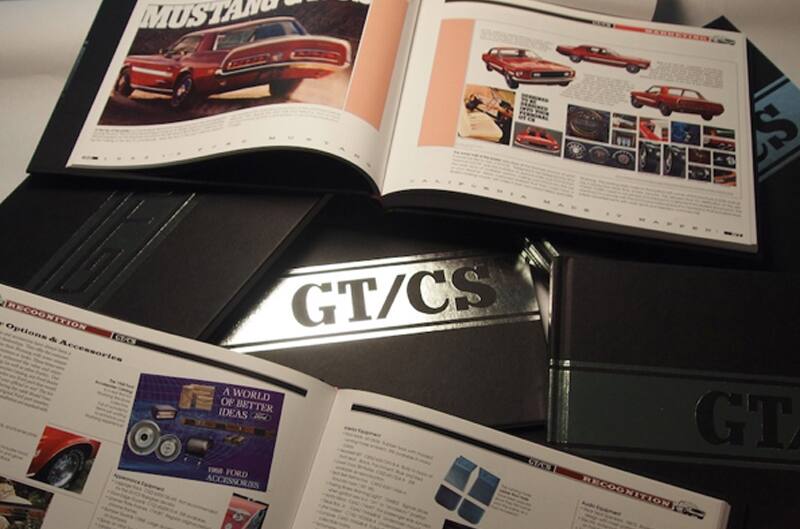 photo of GT/CS plaque with books open on a table