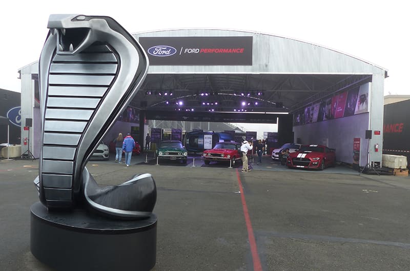 Large Cobra statue with Ford display in background