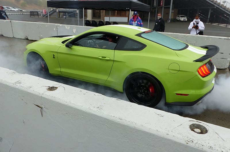 GT500 using linelock doing a burnout at track tour