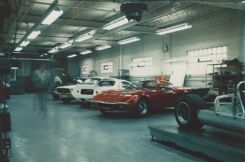 These are the two Mach 2 prototypes in the Kar-Kraft shop. They could be in-between engineering or publicity assignments or awaiting disposition.  The car on the right is Fords G7A Can Am car.