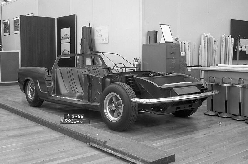 Black and white photo of Mid-Engine Mustang chassis in studio