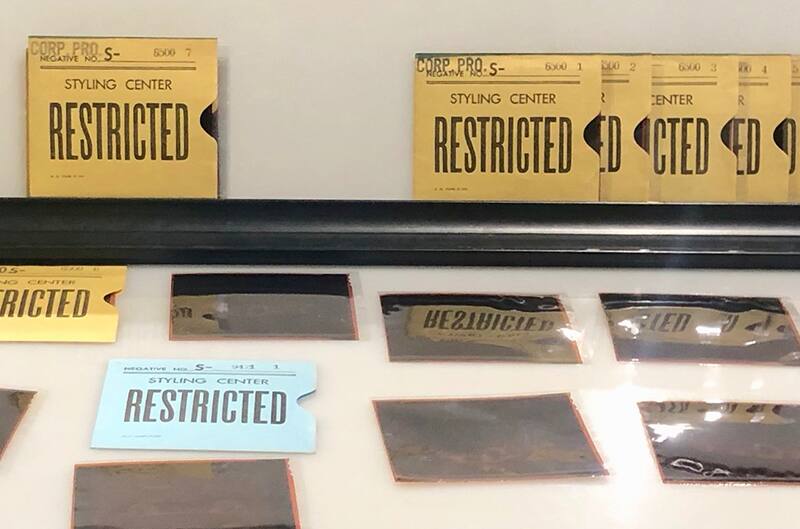 Restricted negative photos laid out on table top