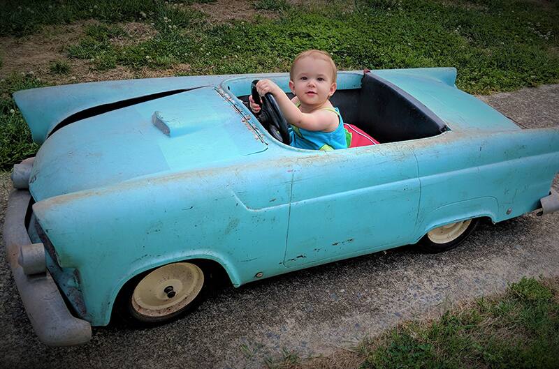 1955 Thunderbird Jr with child in the driver seat