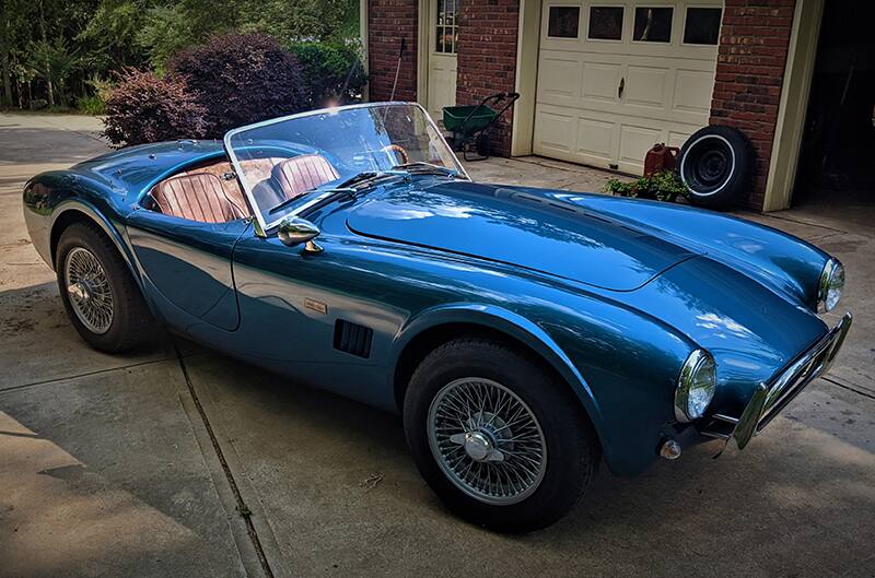 Cobra sitting in driveway at dads