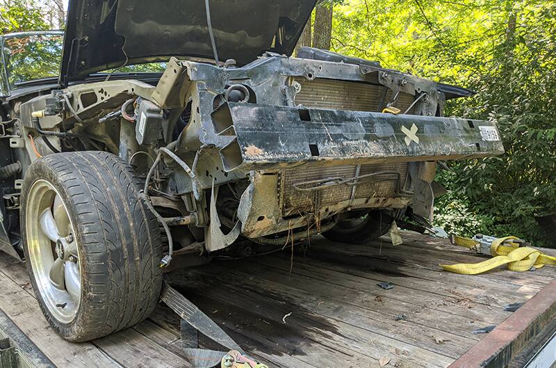 wrecked Bullitt on a trailer