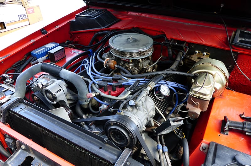 Engine bay of orange stroppe bronco