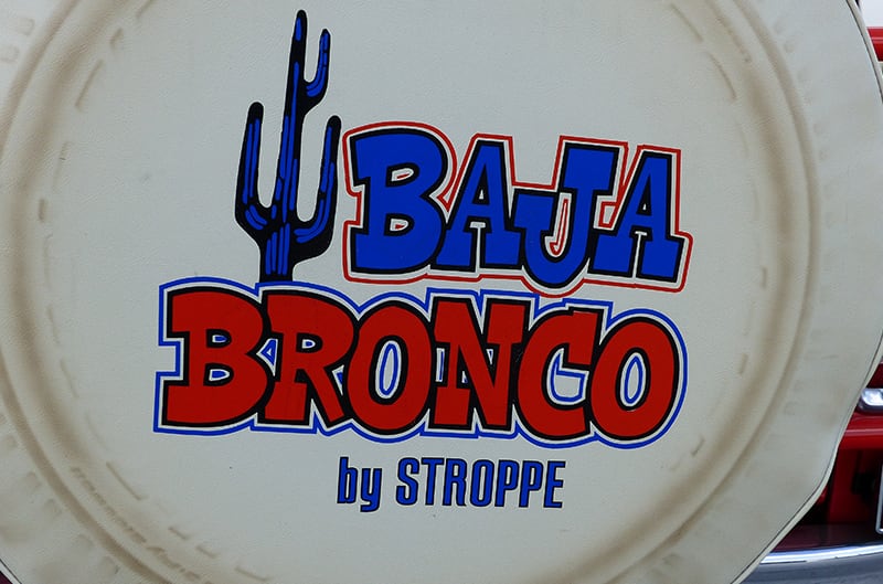 Baja Bronco spare tire cover with logo in blue and orange