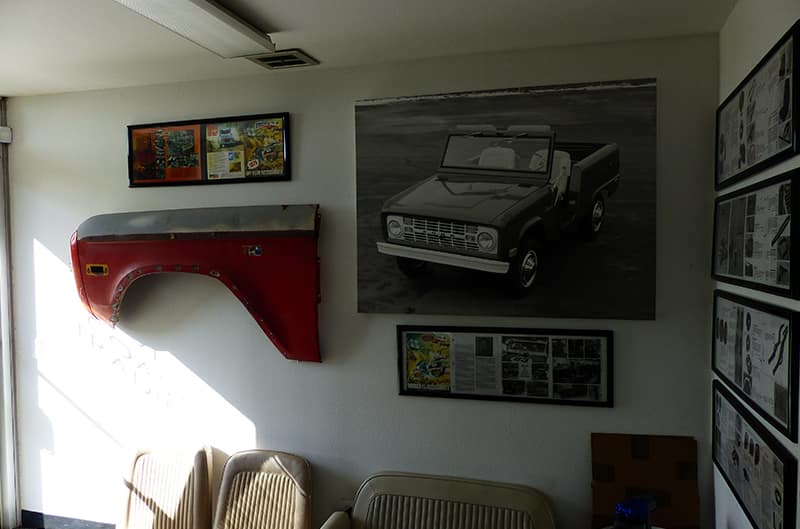 Fender photo and articles mounted on garage wall