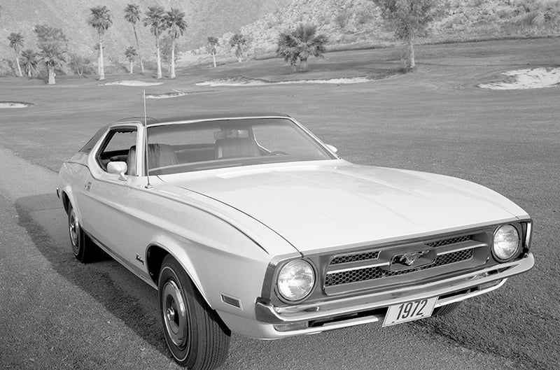 Black and white photo of 1972 Ford Mustang parked on street