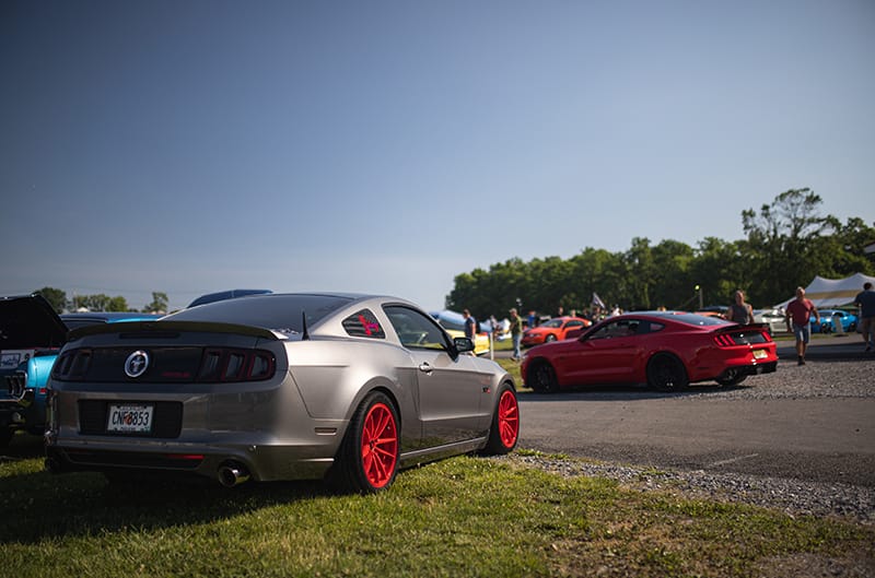 Grey S197 Mustang with red wheels