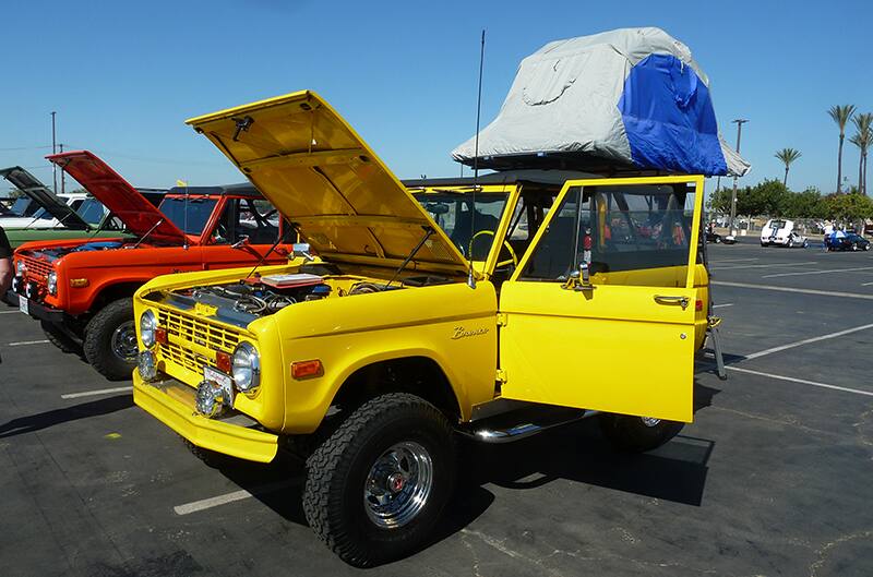 Yellow 1970s Ford Bronco with hood open