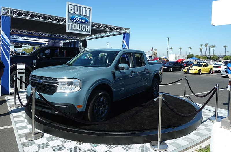 New Ford Maverick truck behind ropes on rotating stage