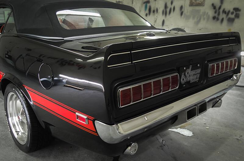 Rear three quarter photo of rear end of mustang with cali special taillights