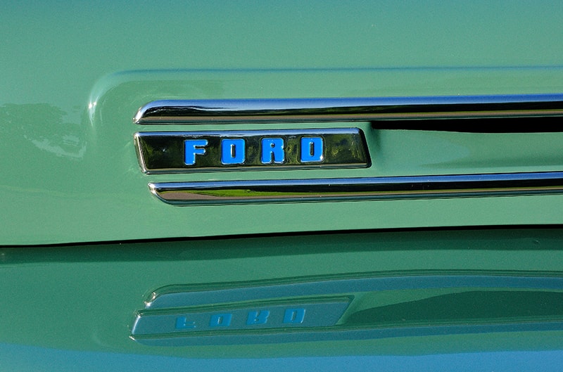 Closeup photo of ford badge on side of hood
