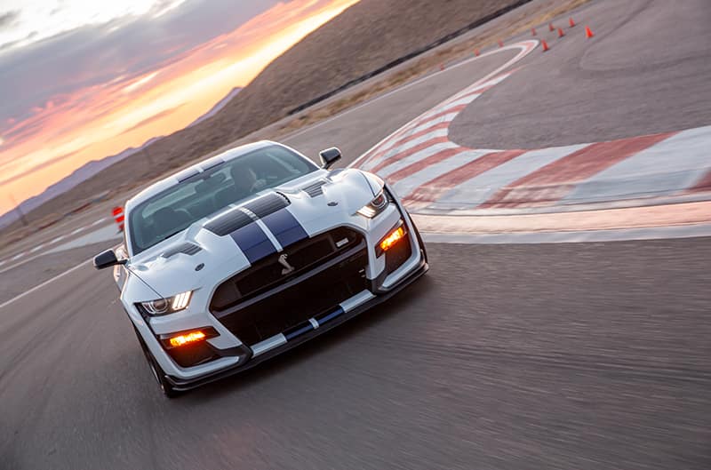 White and Blue GT500 on track at speed