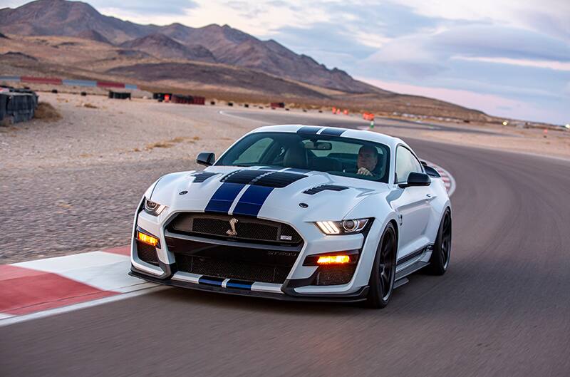 Shelby Mustang on track at dusk in desert