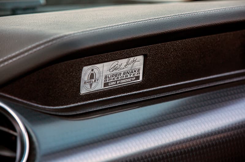 Close up on shelby speedster badge on dashboard