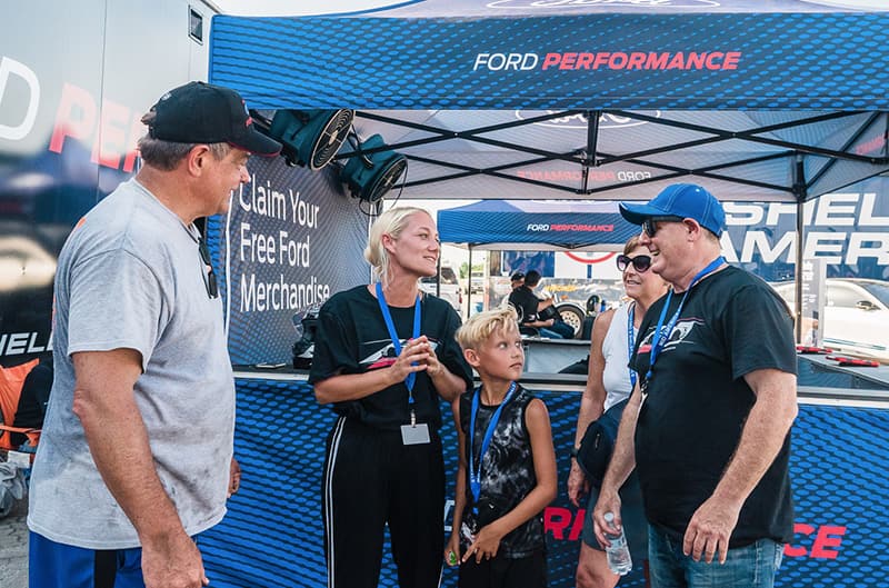 Drivers talking outside of ford performance tent