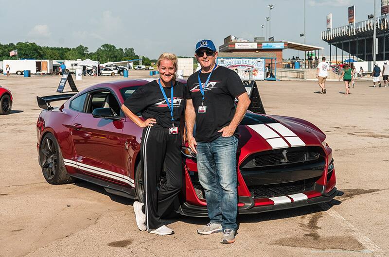 Boren and daughter standing in front of GT500 