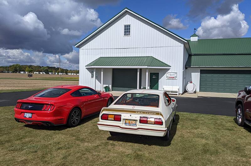 Mustangs at barn for cruise in