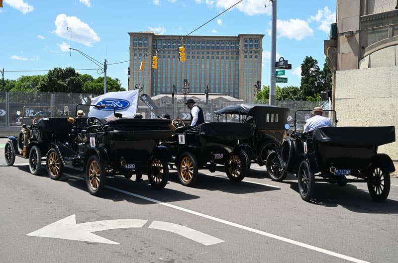 modelT cars in front of train station