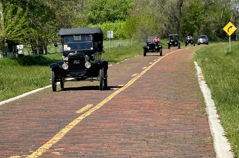 Brick highway with model T driving