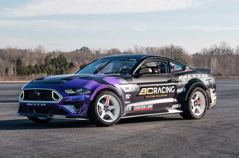 A full view of the DeNofa's new Mustang RTR sporting a refreshing purple, blue, and gold livery