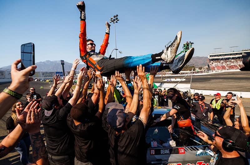 James Deane being hoisted by team in celebration of championship win