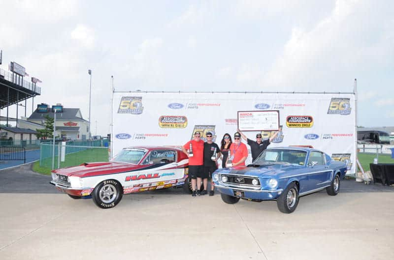 Celebrating wins with their Cobra Jets and trophies, Steven Hall is pictured on the left with his brother, Rusty, and their father Sonny Hall is to the right in the red shirt