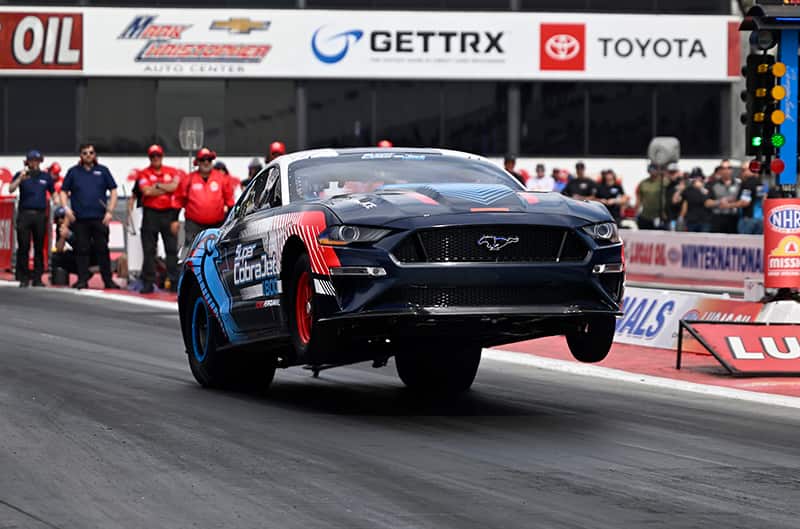 Mustang Super Cobra Jet 1800 with front wheels in the air at Pomona Drag Strip