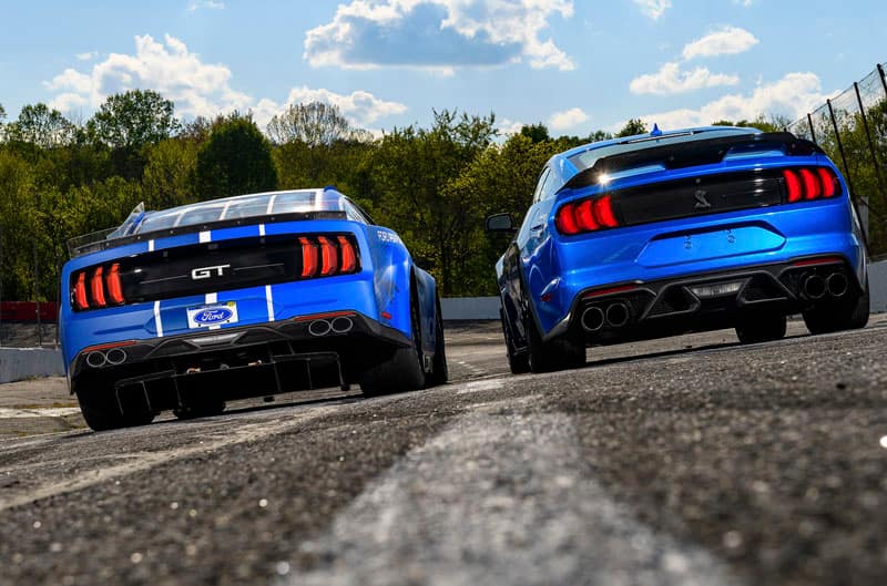 Rear of the production and stock Next Gen Mustang on the track.