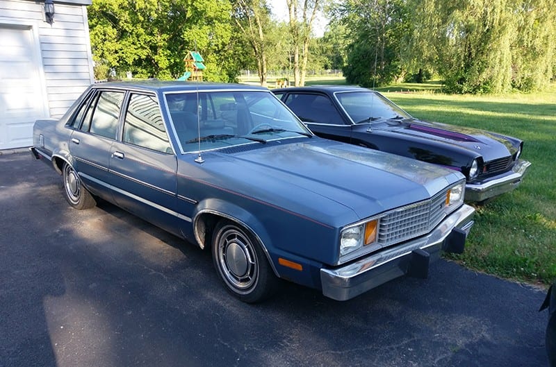 Front profile of a light blue Fairmont Station Wagon in the driveway