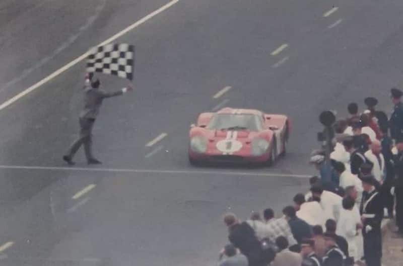 The number 1 red GT40 crossing the finish line 