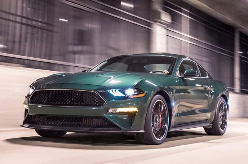 Front profile of green Mustang Bullitt in parking garage