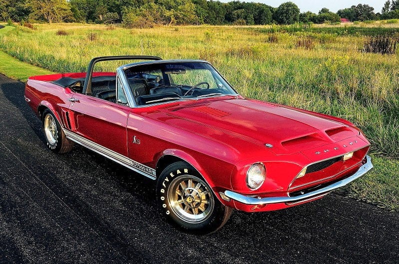 Front side view of 1968 red Shelby GT500KR on road