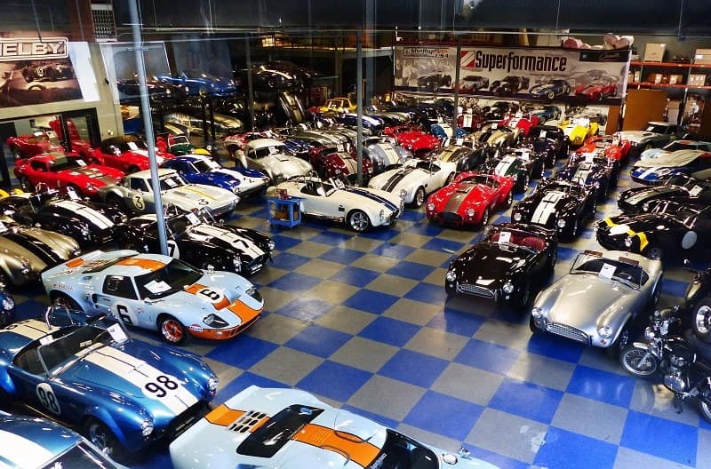 Various Shelby Cobras in garage 