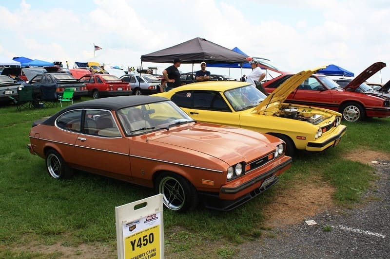 Orange yellow and red Fords in a line 