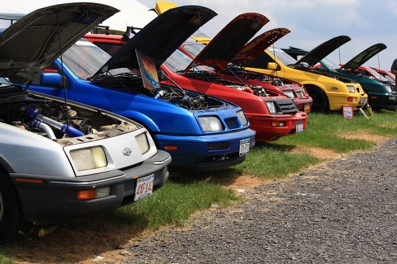 Various Fords in a line at a car show