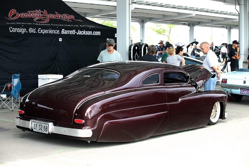 Rear profile of dark red Ford Coupe 