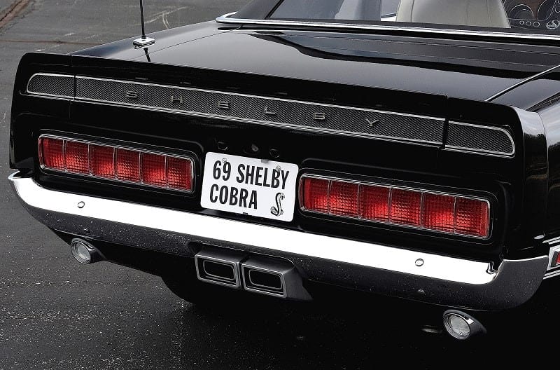 Close up of trunk with Shelby Cobra license plate 