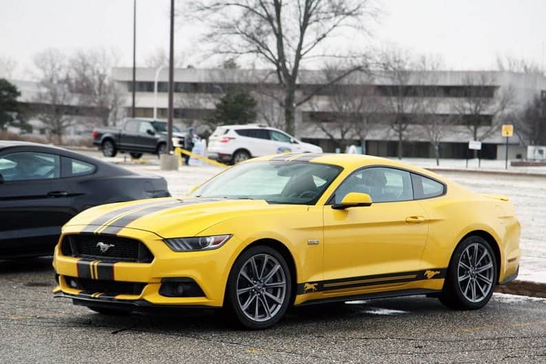 A yellow Ford Mustang at Ford World Headquarters 