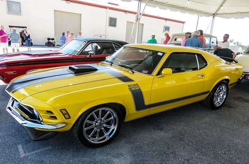 A yellow and black Ford Mustang in Palm Beach