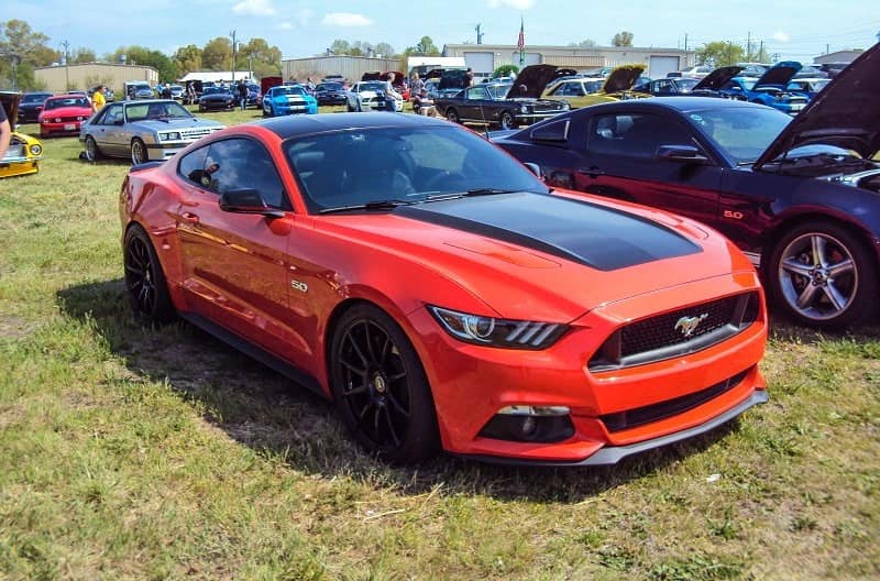 A red and black Ford Mustang on display