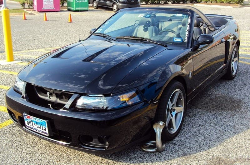 A black Ford Mustang at the Mustang Club