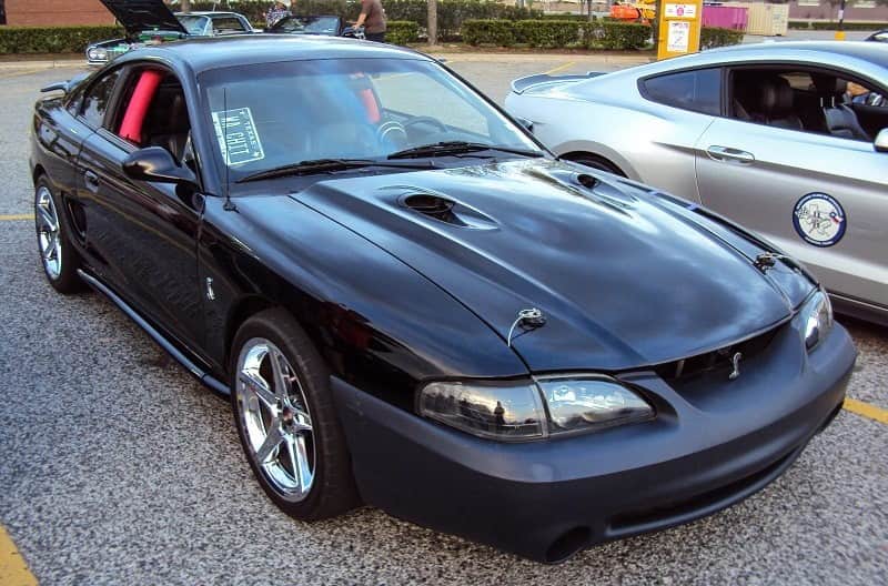 A right side view of a black Ford Mustang 